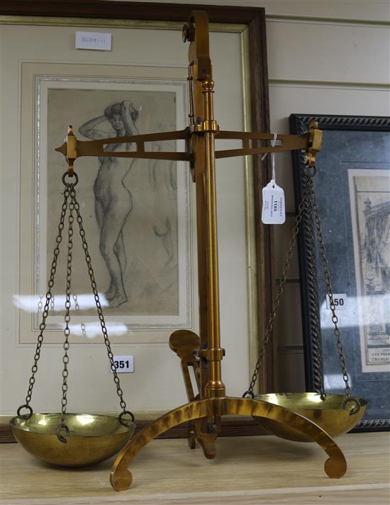 A brass balance on tripod base, with two circular chained pans, by Degrave & Co. height 54cm